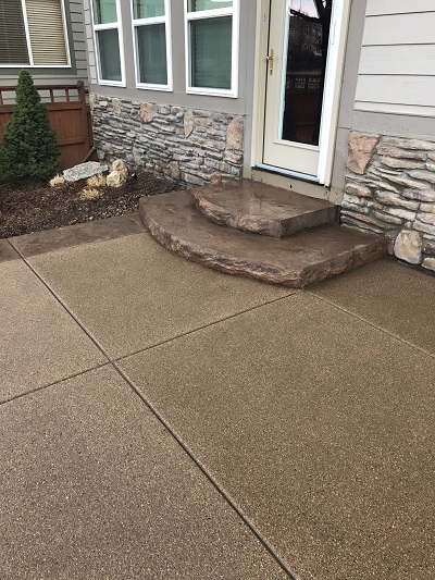 Sand wash look, stamped concrete pad.